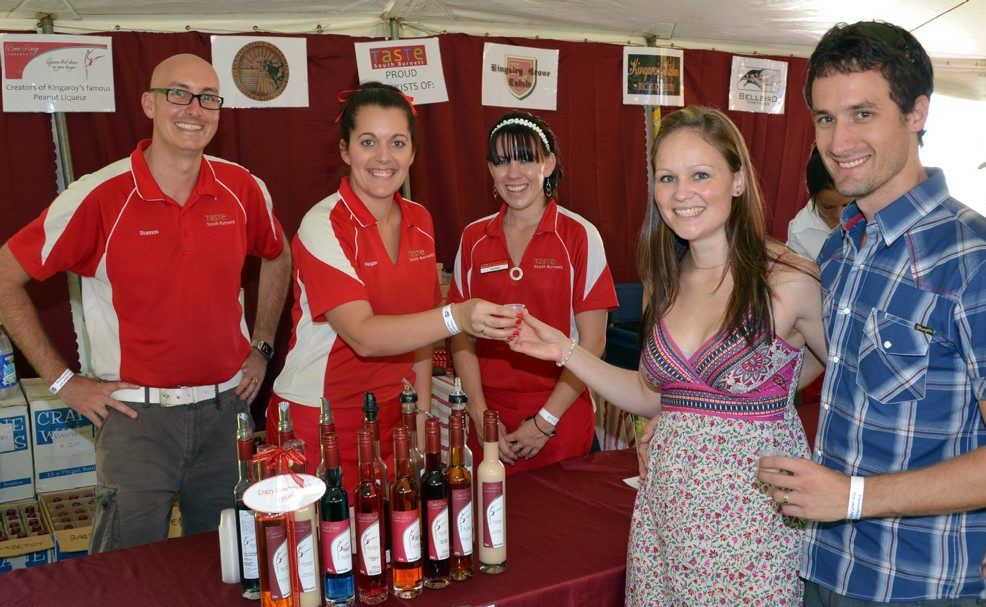 TASTE SOUTH BURNETT: Taste South Burnett owners Shannon and Megan Scott with employee Hannah Winter give Haley and Jarred Pienaar a sample of the products they will showcase at the Regional Flavours Festival, on July 21-22 . Photo Clive Lowe TASTE SOUTH BURNETT: Taste South Burnett owners Shannon and Megan Scott with employee Hannah Winter give Haley and Jarred Pienaar a sample of the products they will showcase at the Regional Flavours Festival, on July 21-22 . Photo Clive Lowe